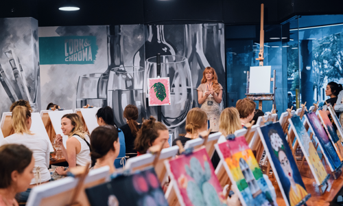 Group of people at a paint and sip team building activity