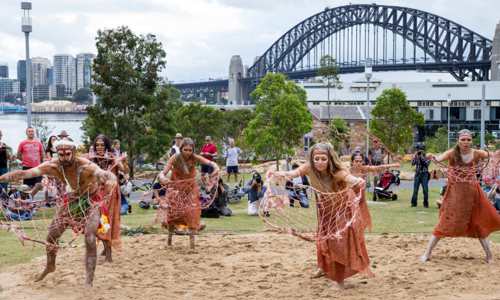 Indigenous group performing at WugulOra, a ceremony celebrating Australias traditional custodians on Australia Day 2016. Image supplierd by DNSW.