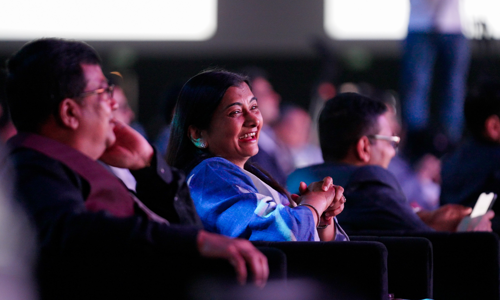 Close up view of smiling delegates seated at the Credai Natcon event 