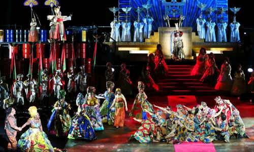 Performers mid-scene on-stage during a performance of Aida for Handa Opera on Sydney Harbour