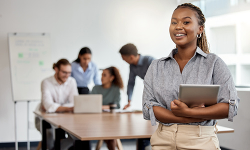 Youthful woman leading a team in technology