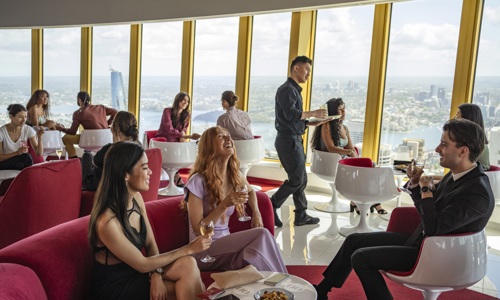 Guests enjoying food and drinks at Bar 83 Sydney Tower 