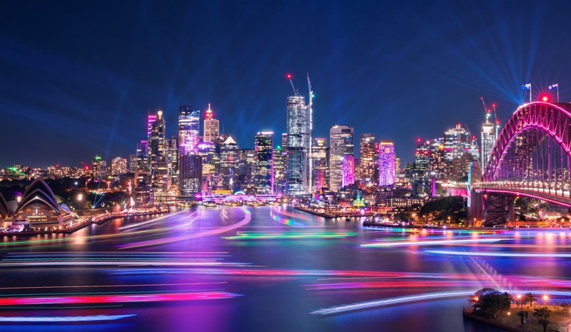 Illuminated harbour view of Sydney Harbour Bridge, Opera House and cityscape at Vivid Event