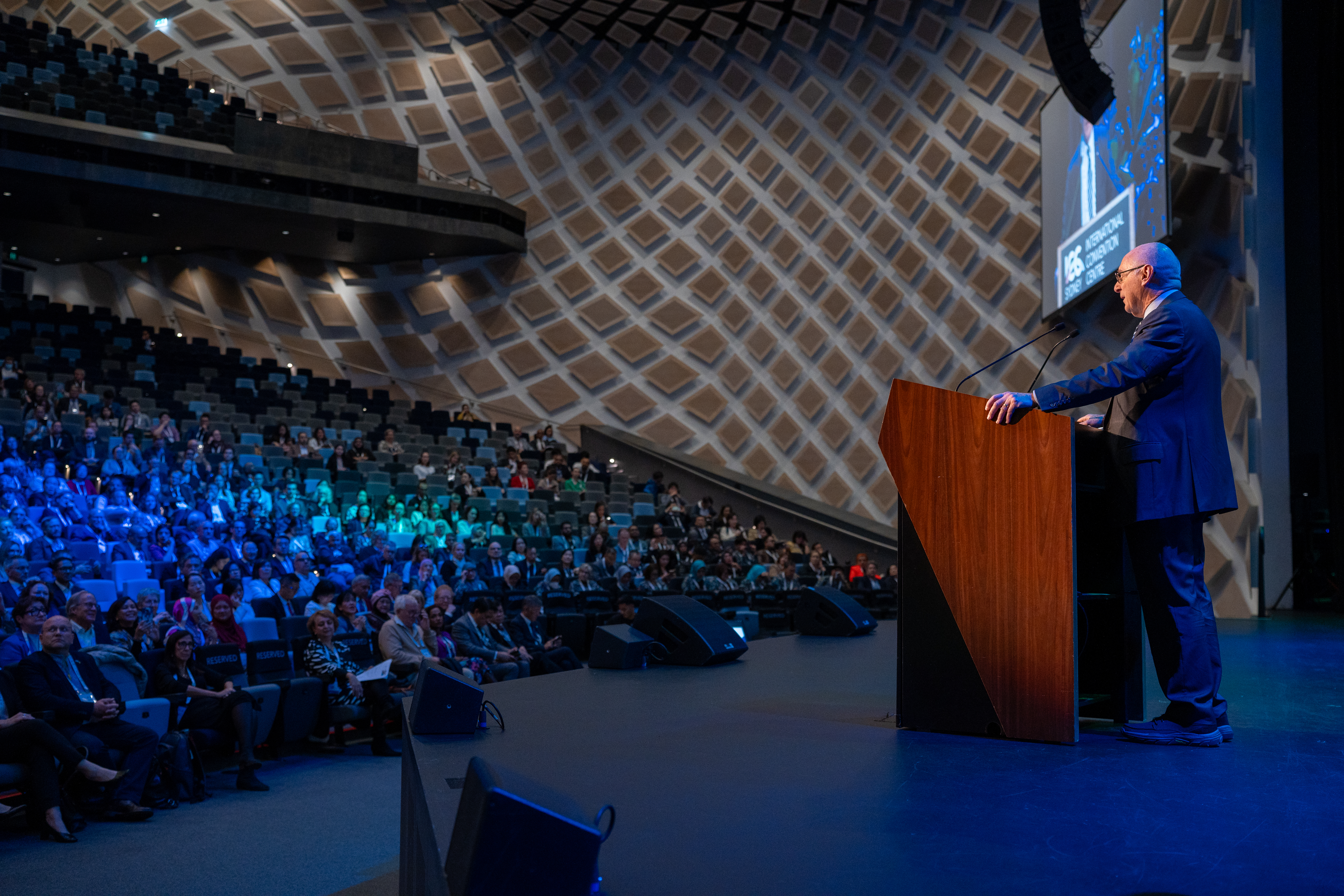 CS 060824 ISPRM World Congress 2024 Speaker On Stage Facing Audience